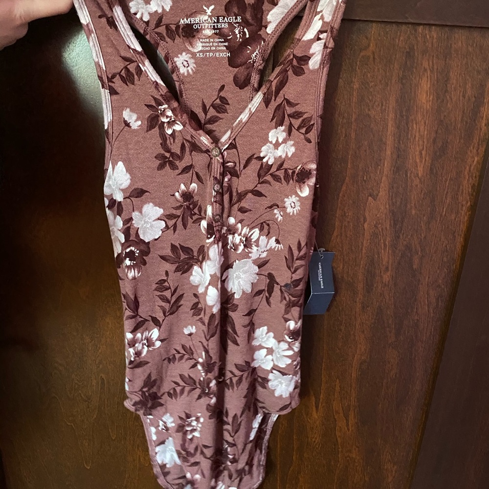 Brand New. American Eagle pink floral bodysuit.